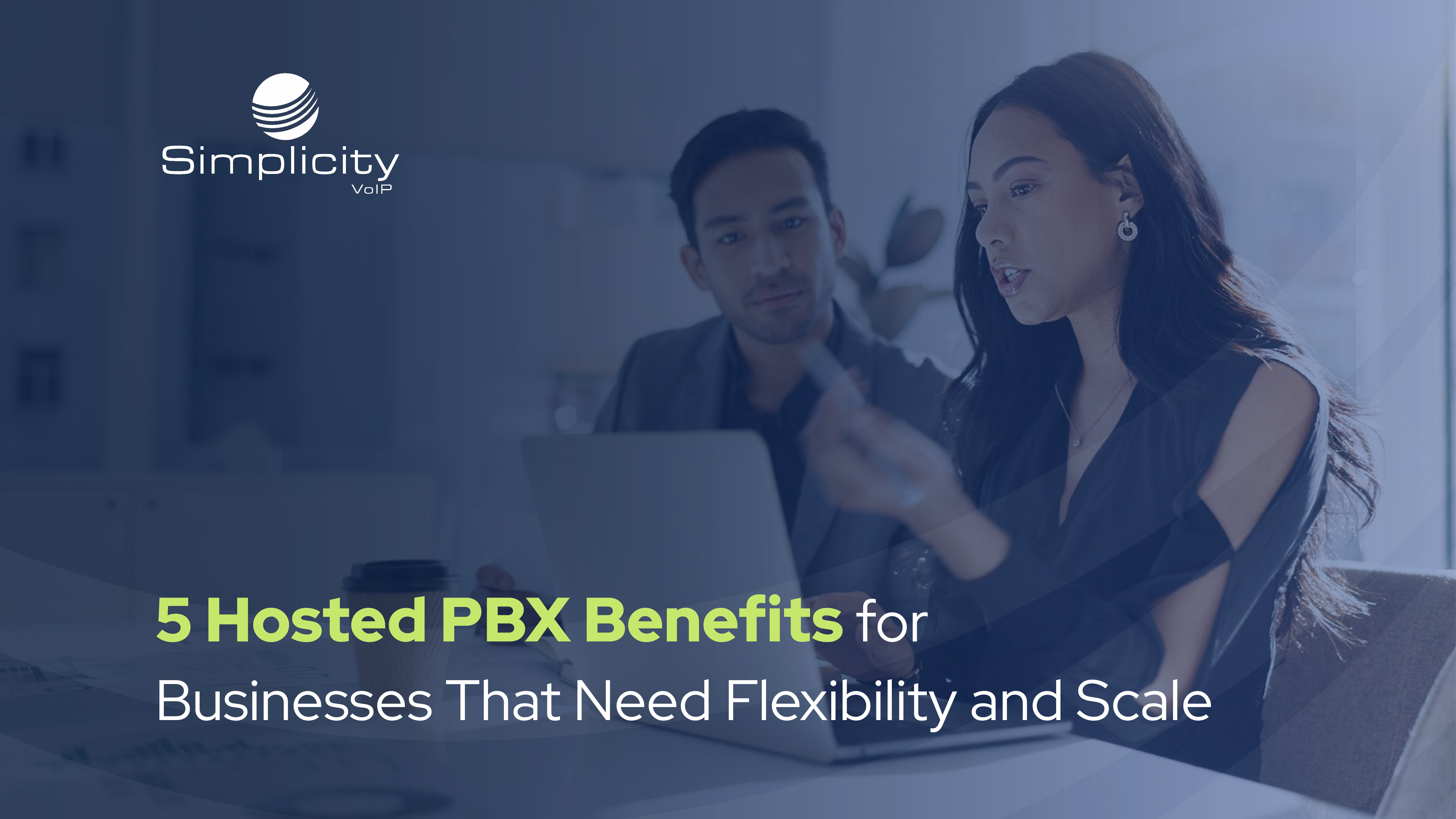 Two professionals reviewing information on a laptop, promoting hosted pbx benefits for businesses that need flexible, scalable communication solutions.