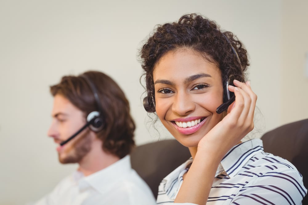 Portrait of smiling businesswoman working in call center
