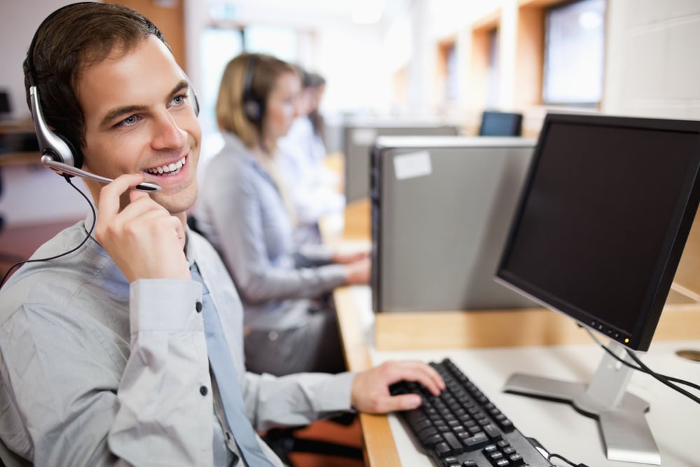 Smiling assistant using a headset in a call center